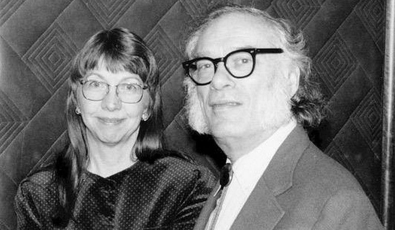 J. O. Jeppson (a friendly-looking white woman) next to her husband Isaac Asimov (HUGE sideburns)
