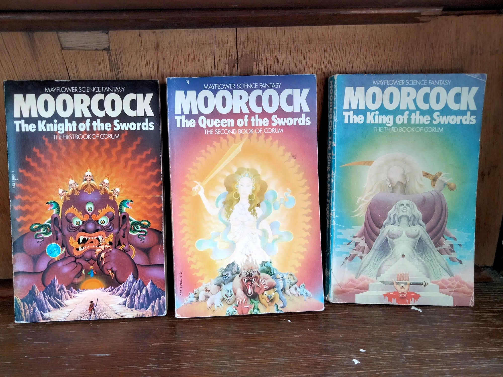 Covers of "The Knight of the Swords", "The Queen of the Swords", "The King of the Swords". Gorgeous psychedelic artwork depicting demonic overlords challenged by a tiny sword-wielding hero.