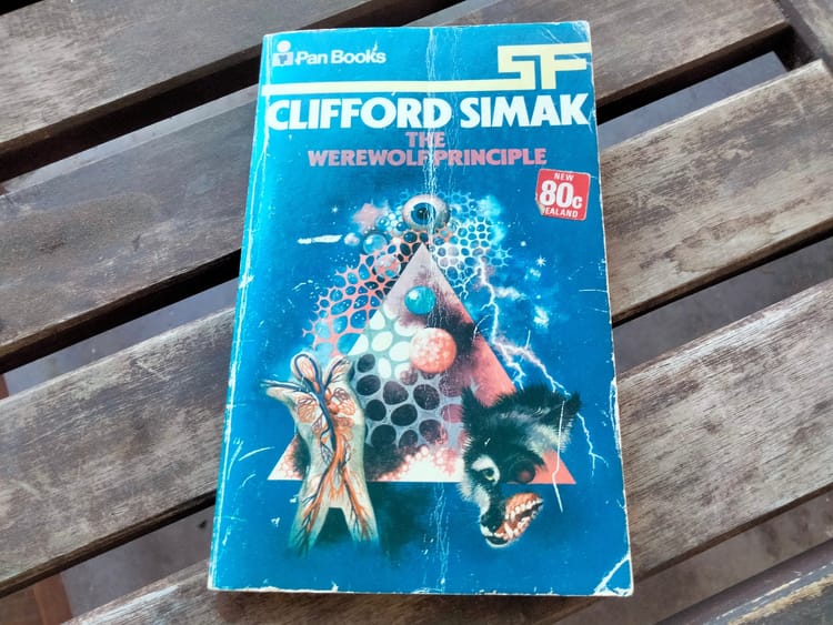 Cover art depicting a fleshy pyramid, a human nervous system, and a melting wolf's head.