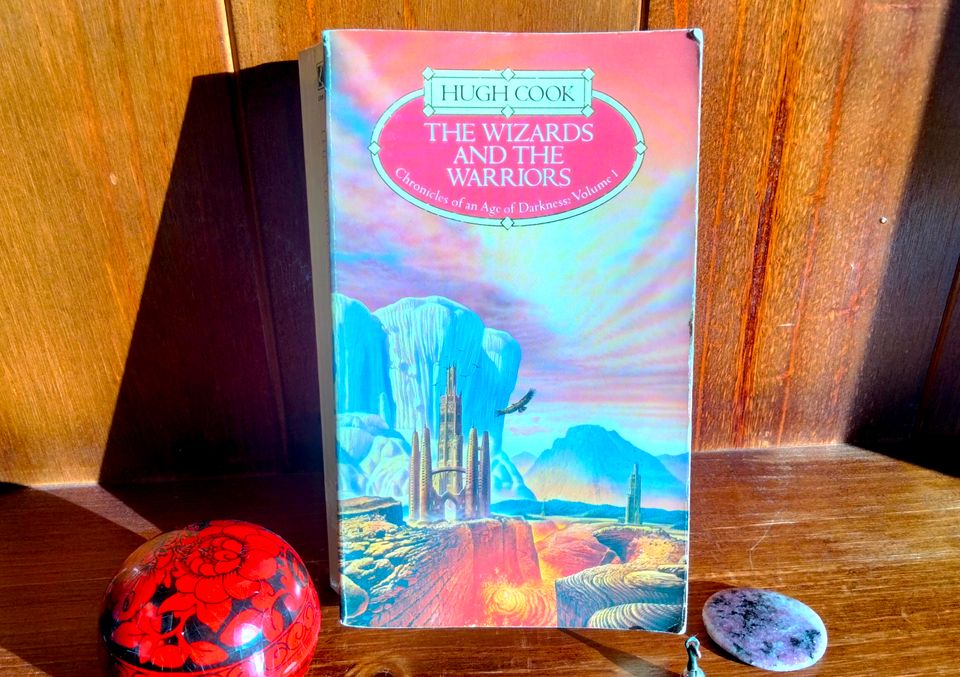 Book cover featuring a fantasy castle, a river of lava and mushroom-shaped mountains